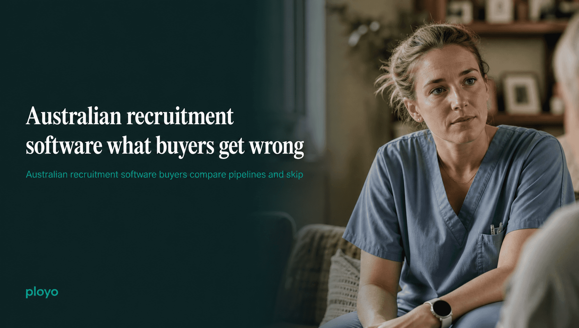 A carer or nurse in soft scrubs, mid-conversation with someone off-frame, listening rather than talking, in a warm domestic interior